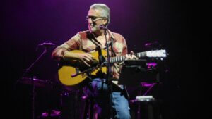 Steve Bell on stage with guitar